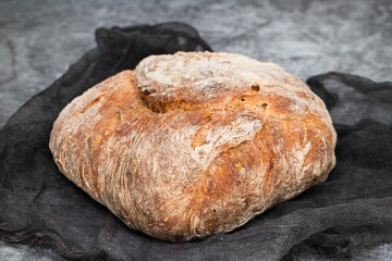 Fresh bread with cereals on dark