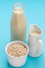 Oat milk. Healthy vegan non-dairy organic drink with flakes