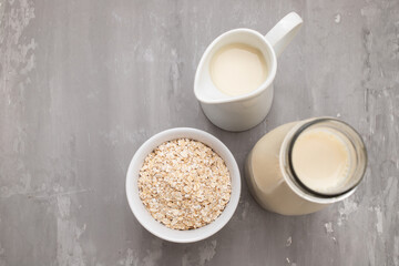 Oat milk. Healthy vegan non-dairy organic drink with flakes