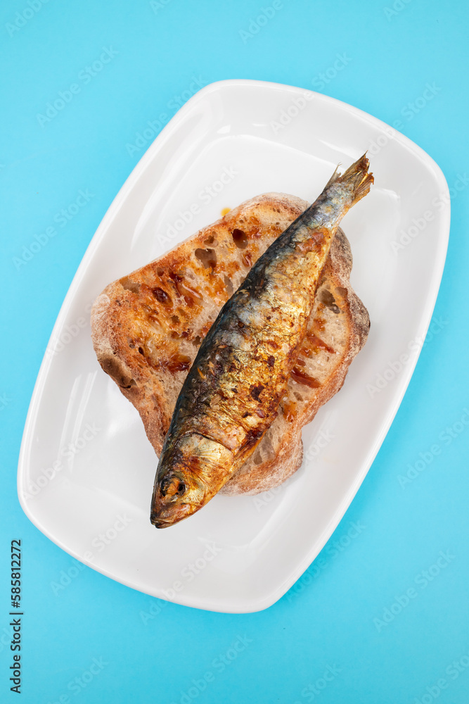 Wall mural Grilled sardines with sauce on fresh bread