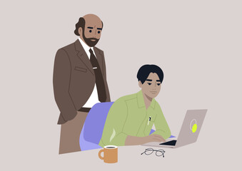 A senior manager supervising an intern in the office