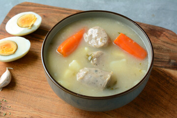 The sour soup (zurek) made of rye flour with sausage and egg. Popular Easter dish