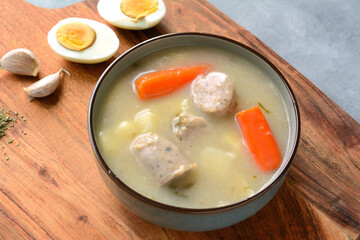 The sour soup (zurek) made of rye flour with sausage and egg. Popular Easter dish