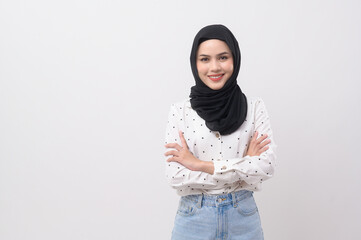 Portrait of beautiful muslim woman with hijab over white background studio.