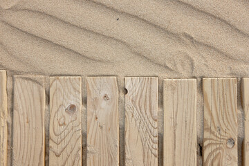 wooden boards on beach sand dunes