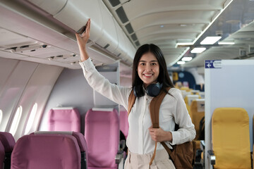 Backpacker asian woman in the airplane while to destination. Travel concept