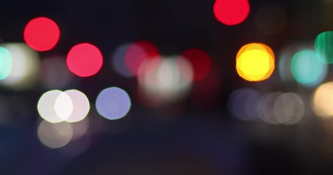 Bokeh of street evening lights, night city with car lights.
