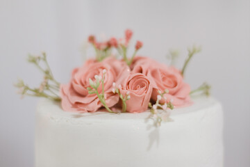 Wedding cake with decorative roses closeup