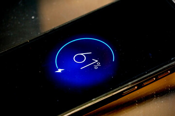 dirty display of a smartphone with graphic on the screen indicating battery level