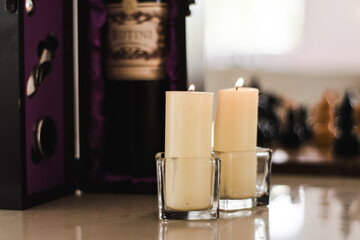 Lit candles in glass containers