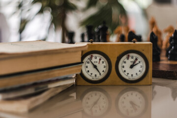 Old books out of focus and chess clock