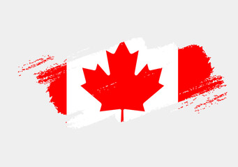 Fototapeta na wymiar Artistic grunge brush flag of Canada isolated on white background. Elegant texture of national country flag