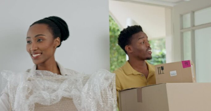 Couple, box and moving into new house, property and real estate together with happy, excited and smile. Black man and woman smiling, homeowner or new home, house or apartment with boxes in relocation