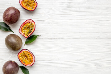 Flatlay of whole and half of fresh passion fruit - marakuya