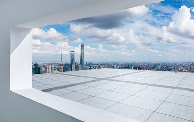 Look at the Shanghai skyline and urban square through the window