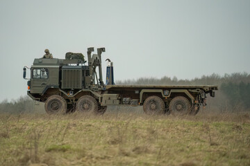 Fototapeta premium unladen British army MAN HX77 8x8 EPLS Heavy Utility Truck in action on a military exercise