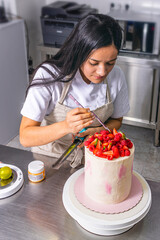 Colombian Pastry Chef. Chef decorating strawberry key lime pie
