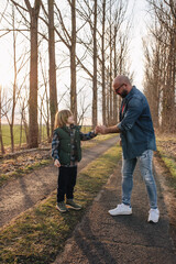 Father and son playing outdoors in spring