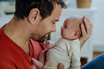 Close-up of father holding his little son.