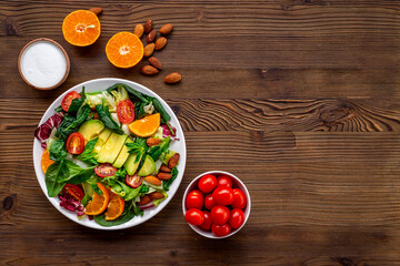 Bowl full of healthy vegetarian salad with avocado and tomatoes