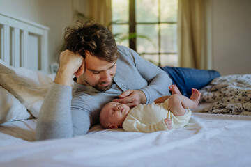 Close-up of father cudddling his little son.