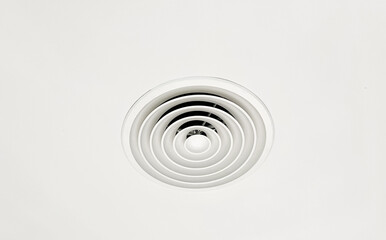 Fototapeta na wymiar Ceiling mounted cassette type air conditioner and modern lamp light on white ceiling. duct air conditioner for home or office