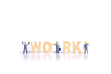 miniature worker people with text wood  isolated on white background