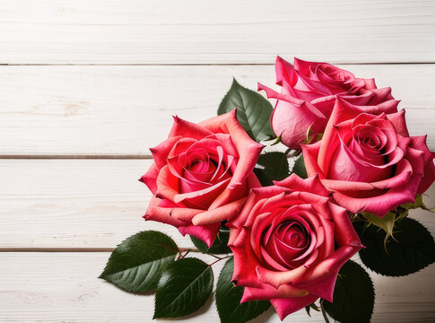 Women: bouquet of red roses on the wooden background