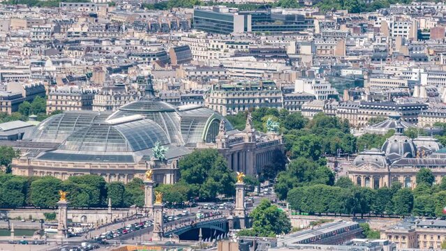Top view of Paris skyline from above timelapse. Main landmarks of european megapolis with Bridge of Alexandre III and Grand Palais. Bird-eye view from observation deck of Montparnasse tower. France