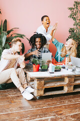 diversity and international group of young people students working on eco friendly urban city project with renewable energy, sustainable development using alternative energy sources, botanical studio