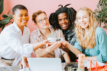 diversity and international group of young people students doctors with sprouts seedling renewable energy, sustainable development using alternative energy sources, botanical experiments of interns