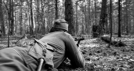 Russian Soviet Infantry Red Army Soldiers Of World War II with weapons Running On Forest Battlefield in attack. Black And White Colors.