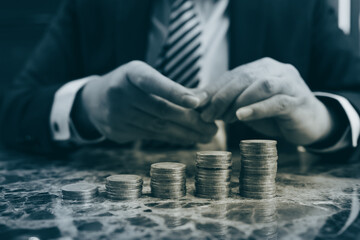 Gold coins stacks is representing riches and wealth management. Coin stack growing and find out the way to get a return on investment. Finance and money exchange investment as concept.