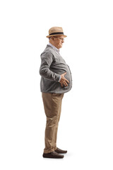 Full length profile shot of a senior man holding his big belly