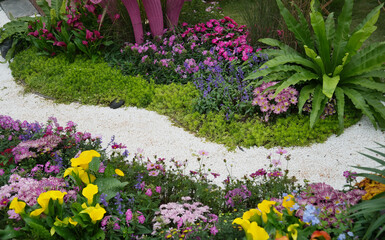 flower path leading through a garden