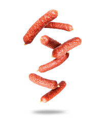 Smoked sausages in the air on a white background