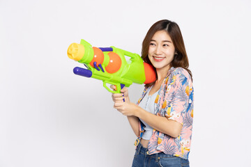 Young Asian woman in summer outfits holding water guns plastic for Songkran festival in Thailand isolated on white background - 585879067