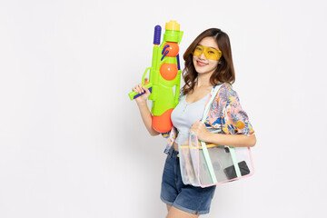 Young Asian woman in summer outfits holding water guns plastic for Songkran festival in Thailand isolated on white background - 585879084