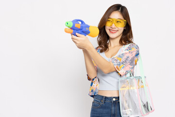 Young Asian woman in summer outfits holding water guns plastic for Songkran festival in Thailand isolated on white background - 585879098