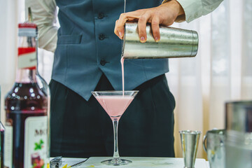 barman serving a cocktail