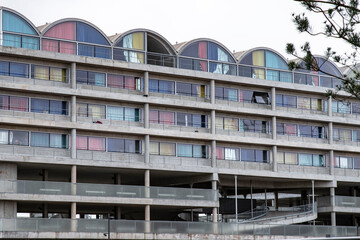 Apartment building with coloured curtains