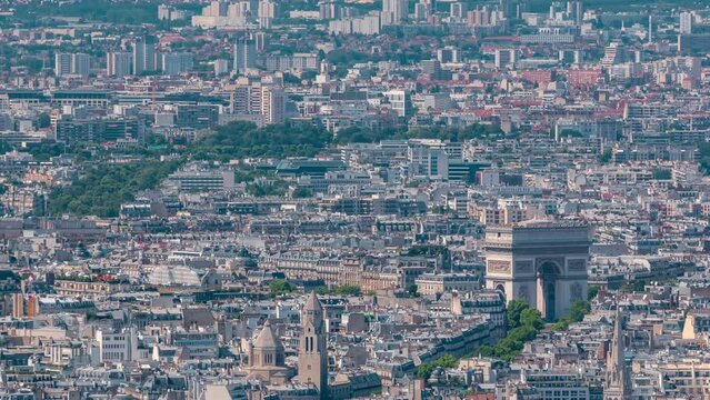 Top view of Paris skyline with the Arc de Triomphe from above timelapse. Main landmarks of european megapolis with Les Invalides. Bird-eye view from observation deck Montparnasse tower. Paris, France