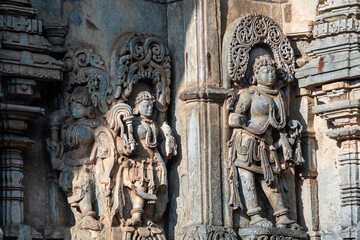 Fototapeta na wymiar Beautiful ornate sculptures and carvings of Hindu Gods and Goddesses at the ancient Channakeshava temple in the town of Belur.
