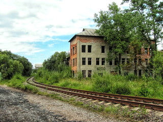 Fototapeta na wymiar On the territory of an abandoned old factory