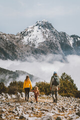 Family hiking in mountains parents with child travel outdoor active healthy lifestyle summer vacations eco tourism in Albania mother and father with kid trekking - obrazy, fototapety, plakaty