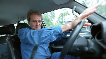 One senior man holding can steering wheel driving in city while talking in conversation out loud. Older male caucasian person driver commuting