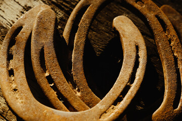 Rusty horseshoes for western industry or farrier concept.