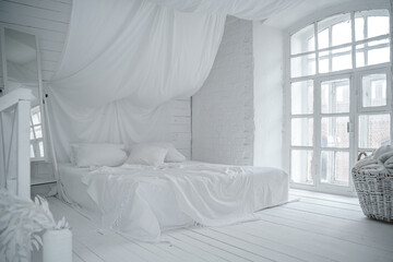 large white bed on the floor