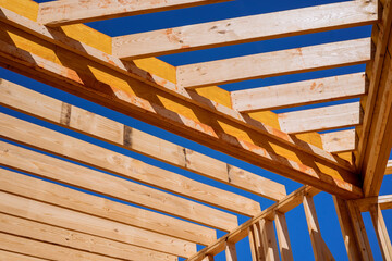During construction of newly constructed wooden house framing beam supports framework construction layout joists.
