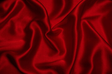 Red silk or satin luxury fabric texture can use as abstract background.